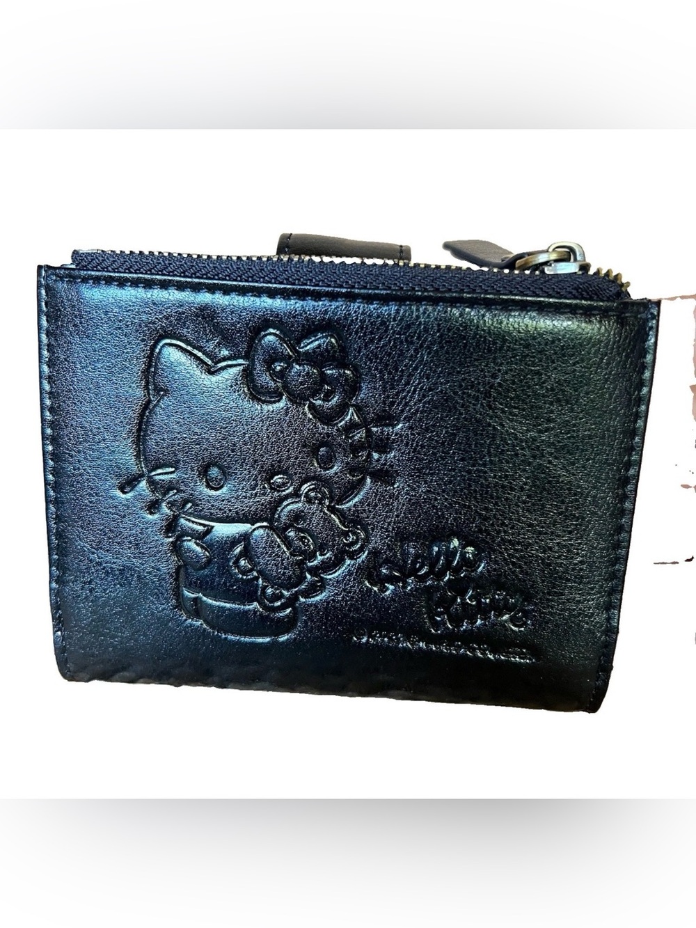 Black Embossed Hello Kitty Bifold Wallet With a Zipper Pocket
